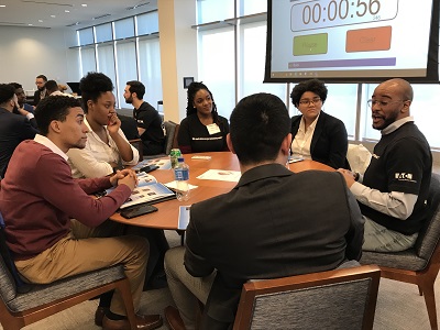 Students participating in a speed mentoring session with Eaton employees.